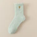 Cozy coral fleece fuzzy winter socks for women in mint green with cute embroidered gold heart. - One Size / Light Green