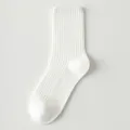 White cotton ribbed mid-calf socks for women, breathable casual crew socks, comfortable fit. - White