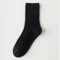 Classic black ribbed cotton mid-calf socks for women, comfortable breathable everyday wear. - Black