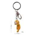 Nahaufnahme Detail des süßen orange Katzen Schlüsselanhängers mit Maßen und Metallring. - Gelber Katzendruck / Einzelpreis