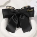 Elegant black satin hair net bow with houndstooth pattern detail and metal accent. - Black Plaid Coarse Mesh