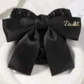 Elegant black bow hair net with satin and tweed texture, perfect for professional work wear. - Anxiang Coarse Mesh