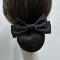 Close-up detail of the black professional hair net bow clip, showing fine mesh and ribbon texture. - Fine Mesh / Black with Beige Edge