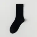 Black women's mid-calf cotton socks, comfortable daily casual basic solid design. - One Size / Black