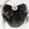 Close-up detail of the black bow hairnet with pearl rhinestone flower, hair accessory. - White Yarn Large Pearl Fine Mesh / Black