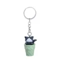 Close-up detail of the cute cat ice cream cone keychain, showing the fine resin texture and hardware. - Gray Cat + Green Bucket Keychain