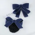 Detail shot of navy blue bow hair clip and hair net set, professional uniform accessory. - Blue and Beige Edged Set