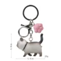 Niedlicher dicker Katzen-Schlüsselanhänger mit rosa Pfoten-Anhänger und Metallkarabiner. - Karabiner-Stil / Braun-Weiße Katze (Rosa Kralle)