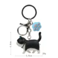 Süßer schwarzer Katzen Schlüsselanhänger mit blauer Pfote Metall Clip Taschen Anhänger - Karabiner-Stil / Schwarz-weiße Katze (Blaue Kralle)