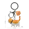 Niedlicher dicker Katzen-Schlüsselanhänger mit Pfoten-Anhänger und Metallkarabiner 4.6cm. - Karabiner-Stil / Gelb-Weiße Getigerte Katze (Gelbe Kralle)