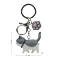 Portachiavi gatto grigio paffuto carino con ciondolo zampa di gatto e moschettone. - 2ª Gen Gatto Grigio Bianco / Zampa di gatto grigia