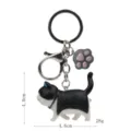 Süßer schwarz-weißer Katzen Schlüsselanhänger, Acryl Katzenpfote Anhänger Metallring. - Karabiner-Stil / Schwarz-Weiße Katze (Graue Kralle)