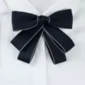 Classic dark blue bow tie with light edge detail, perfect for professional work uniform wear. - Black & Beige Trim Collar Flowers