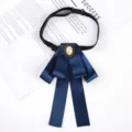 Dark blue professional ribbon bow tie with pearl centerpiece and adjustable neck strap. - Oval Ribbon Bow Brooch