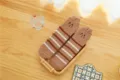 Cozy brown coral fleece fuzzy socks detail showing soft striped texture and cute embroidery. - One Size / Size 11