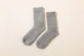 Thick warm wool socks in classic grey, cozy winter thermal knitwear detailed close-up shot. - Fits Size EU 38-46 / Men's Medium Grey