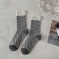 Cozy winter striped wool socks detail view, featuring soft ribbed cuff and classic pattern. - One Size / Striped Cuff with White and Dark Gray Heel