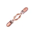 Vintage copper shawl clip detail showing the intricate twisted knot metal design and sturdy duckbill. - 912-2