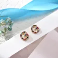 Detail view of the elegant letter G rhinestone earrings, featuring colorful sparkling crystal stones. - Letter G
