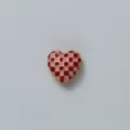 Pink and red checkerboard heart shape accessory detail shot, gold outlined stylish design. - Pink & Red Checkered - Heart