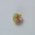 Close-up detail of exquisite multi-color resin floral decorative buckle with vibrant crystal beads. - Colorful