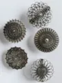 Close-up details of vintage hollow metal shawl clips and scarf buckles in ethnic floral style. - Antique Silver Set / Five-Piece Set