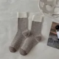Detailed shot of retro women's striped mid-tube socks, warm knitted thermal hosiery for winter. - One Size / Striped Style with White Cuff and Coffee Heel