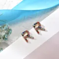 Colorful rhinestone letter R stud earrings for women, stylish gold-toned metal minimalist jewelry. - Letter R