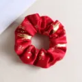 Chouchou de Noël en velours rouge avec motifs dorés de rennes et d'étoiles - Édition De Noël - Dorure À Chaud Rouge De Noël