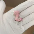 Cute pink unicorn dust plug for 3.5mm headphone jack, miniature phone accessory detail. - Fortune Horse / Pink