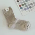 Ribbed mid-calf socks in pastel beige, vertical stripe knit design, cozy daily wear. - One Size / Mocha