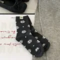 Dark grey cotton crew socks with white snowflake pattern and cute cuff label for winter. - One Size / Dark Gray