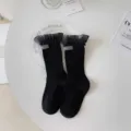 Black mid-calf women socks with mesh ruffles and chic label for sweet JK daily wear. - One Size / Black Large Lace Edge