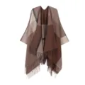 Detailed view of women's autumn and winter plaid fringed cape shawl scarf outerwear. - Coffee