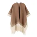 Detailed view of the ethnic style color-blocked knit poncho shawl featuring a stylish fringe hem. - Robe / Khaki