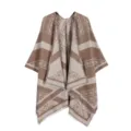 Close-up detail of the stylish brown and beige paisley jacquard fringe cape and shawl. - Khaki