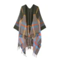 Detailed close-up of the women plaid leopard print cape with cozy fringe and knit texture. - Green