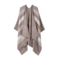 Detailed view of women's cozy knit striped cape shawl with elegant tassel hem for autumn. - Tops / Khaki
