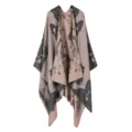 Detailed view of stylish knitted cape shawl featuring an elegant abstract pattern and cozy drape. - Khaki