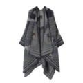 Detailed view of a stylish knitted cape shawl featuring retro horse and geometric patterns for cozy warmth. - Navy Blue