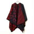 Reversible leopard print knitted poncho shawl, cozy winter warmth cape detail view. - Zebra Red