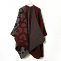 Detail view of the winter colorblock knit cape featuring striking leopard and zebra patterns. - Zebra Print Green & Orange