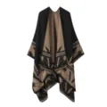 Detailed view of the black and brown knit poncho showing fine geometric weaving and soft texture. - Black Camel