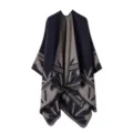 Detailed close-up view of the knitted poncho highlighting its unique geometric pattern. - Navy Blue