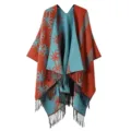 Detailed view of the stylish women reversible knitted poncho shawl featuring fringe and contrast patterns. - Flocked Large Flower - Orange & Blue