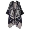 Detailed view of the thick knit plaid cape showing the soft fabric texture and neat stitching. - Striped Plaid - Navy Blue