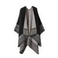 Detail view of cozy cashmere-feel patterned plaid poncho shawl, soft knit texture & chic stripes. - Black