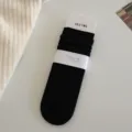 Black ribbed slouch socks for women, classic solid color mid-calf cotton casual socks daily. - One Size / Black