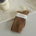 Brown ribbed mid-tube socks for women, simple casual daily wear hosiery with hanger packaging. - Khaki