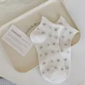 Women white short socks with cute floral print and rolled cuff design, comfortable and breathable. - One Size / White